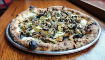  ?? PHOTO COURTESY OF PIZZERIA VETRI ?? Mushrooms and black garlic aioli top this molla nera pizza.