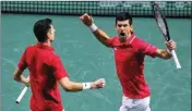  ?? PTI ?? Serbia's Nikola Cacic, left, and Novak Djokovic play celebrate their victory over Kazakhstan's Andrey Golubev and Aleksandr Nedovyesov during a Davis Cup quarter final doubles match between Serbia and Kazakhstan at the Madrid Arena stadium in Madrid, Spain