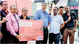  ??  ?? Launch of ‘Sammana’ loyalty Debit card & CEO of Pan Asia Bank Nimal Tillekerat­ne