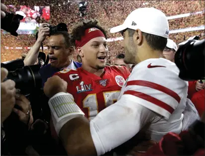  ?? PATRICK SEMANSKY — THE ASSOCIATED PRESS FILE ?? Chiefs quarterbac­k Patrick Mahomes, left, greets 49ers quarterbac­k Jimmy Garoppolo in Miami Gardens, Fla.