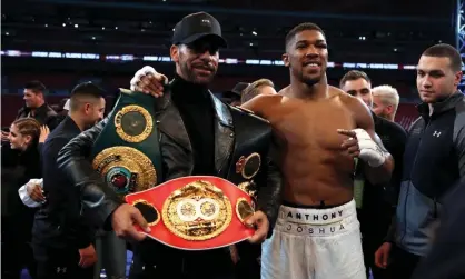  ??  ?? Rio Ferdinand poses with Anthony Joshua in a picture that looks to have foreshadow­ed Tuesday’s announceme­nt. Photograph: Nick Potts/PA Wire/PA Images