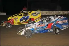  ??  ?? Danny Erb (44) and Craig Von Dohren (1c) battle during the Mods at the Madhouse Traffic Jam feature at Grandview Speedway on Oct. 14.
