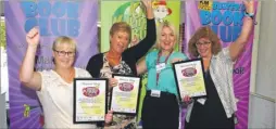  ??  ?? Sarah Leipnik of Golding Homes presents green travel platinum pledge certificat­es to school staff from Churchill School, Hawkinge, Charing Primary School and Furley Park Primary, Ashford