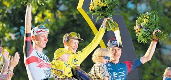  ?? Photos / Photosport ?? Tadej Pogacar (left), Jonas Vingegaard Jonas and Geraint Thomas on the podium at the conclusion of the 2022 Tour de France.