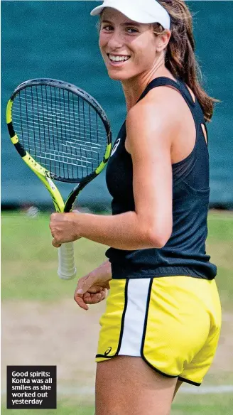  ??  ?? Good spirits: Konta was all smiles as she worked out yesterday