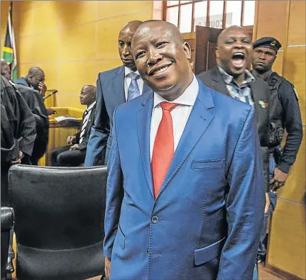  ?? Picture: AFP ?? ALL SMILES: Economic Freedom Fighters leader Julius Malema arrives in Polokwane High Court yesterday to stand trial for fraud and racketeeri­ng linked to a $5-million government contract won six years ago