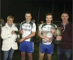  ??  ?? Moira Mann presents the Culleton Cup to joint captain Ian Bracken and joint captain Jack Hamilton receives the Carter Cup from Wicklow GAA Vice-Chairman Martin Fitzgerald. Photos: Garry O’Neill