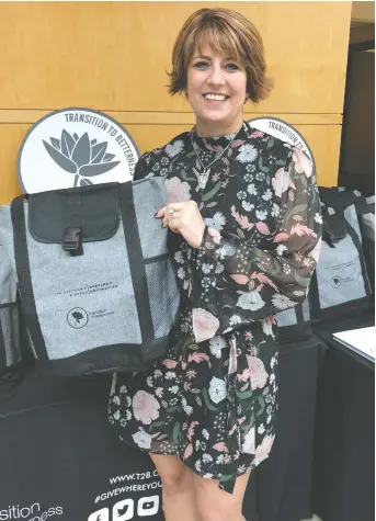  ?? SUPPLIED ?? The late Dr. Michelle Prince is shown holding one of the Comfort Care Totes that are distribute­d by Transition to Betterness. The program launched in May 2018.