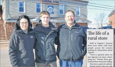  ?? ERIC MCCARTHY/JOURNAL PIONEER ?? Carter Morrissey, centre, receives good wishes from Tommy and Joanne Perry as the Morrissey family prepares to take ownership of the Tignish store the Perrys have operated for the past 32 years.