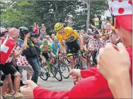  ?? [CHRISTOPHE ENA/THE ASSOCIATED PRESS] ?? Britain’s Chris Froome, wearing the overall leader’s yellow jersey, has separated himself from the field and holds an 18-second advantage after the ninth stage of the Tour de France.