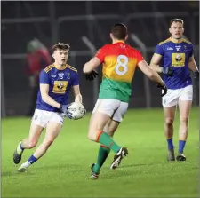  ??  ?? Gearoid Murphy looks to take on Carlow’s Sean Murphy.