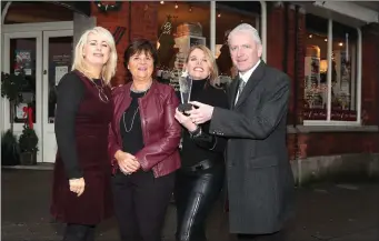  ??  ?? Fiona, Carmel and Lelia from The Design Gallery accept the award from Hubert Murphy of the Drogheda Independen­t.
