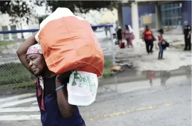  ?? PICTURE: AP ?? SEEKING SHELTER: Evacuees are moved to another building with more bathrooms while sheltering at Florida Internatio­nal University ahead of Hurricane Irma in Miami. Millions fled Florida before the storm made landfall there.