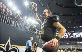  ?? DERICK E. HINGLE, USA TODAY SPORTS ?? Saints quarterbac­k Drew Brees joined the 6,000 completion club but didn’t throw a touchdown pass in the victory.