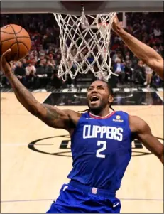  ?? Mark J Terrill, File
AP Photo/ ?? In this March 1 file photo, Los Angeles Clippers forward Kawhi Leonard shoots as Philadelph­ia 76ers forward Al Horford defends during the second half of an NBA basketball game in Los Angeles.