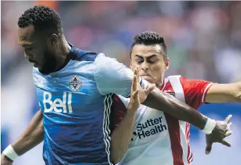  ?? THE CANADIAN PRESS ?? Whitecaps captain Kendall Waston pushes aside San Jose’s Darwin Ceren during a costly 1-1 draw in Vancouver. Now the Caps are preparing to host San Jose in an eliminatio­n playoff contest.