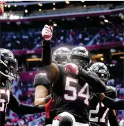  ?? JOHN BAZEMORE/ASSOCIATED PRESS ?? Falcons linebacker Foye Oluokun (54) celebrates after intercepti­ng Lions quarterbac­k Tim Boyle’s pass on the 1-yard line with 33 seconds remaining Sunday.
The Falcons won 20-16.