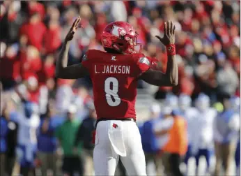  ?? AP PHOTO ?? Louisville's Lamar Jackson celebrates after scoring a touchdown against Kentucky in an NCAA college football game Nov. 26 at Papa John's Cardinal Stadium in Louisville, Ky.