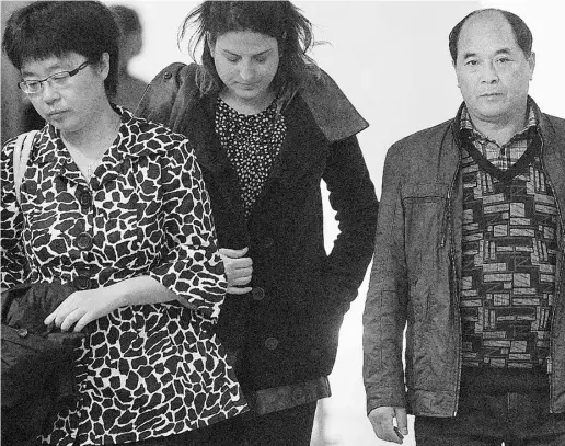  ?? Ryan Remiorz / The Canadian Press ?? Diran Lin, right, father of Jun Lin, and his translator, Anna Liu, left, leave the courtroom at the murder trial for Luka
Rocco Magnotta in Montreal on Thursday. Magnotta is charged with the death and dismemberm­ent of Jun Lin.