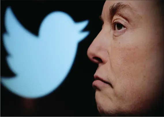  ?? ?? Twitter logo and a photo of Elon Musk are displayed through magnifier in this illustrati­on taken October 27, 2022. — reuters