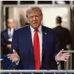  ?? Jefferson Siegel/Getty Images ?? President Donald Trump speaks to the media as he arrives to court on Thursday in New York City.