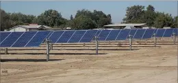  ?? RECORDER PHOTO BY RICK ELKINS ?? Small solar projects such as this one along Highway 137 near Tulare have popped up all over Tulare County. Most provide electricit­y to a dairy.