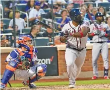  ?? AP PHOTO/MARY ALTAFFER ?? Atlanta Braves’ Abraham Almonte watches his two-run home run during the third inning Tuesday against the New York Mets in New York. The Braves won 12-5.