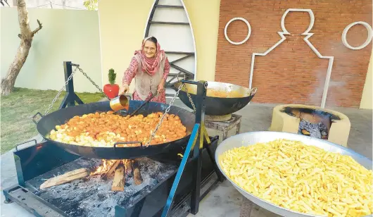  ?? VEG VILLAGE FOOD ?? More than 5 million followers tune in to a web series where they can watch Amar Kuar cook food from the simple setup in her family’s courtyard in her village in India.