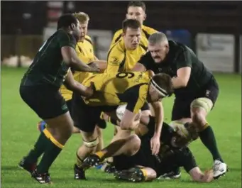  ??  ?? Ashbourne’s Frank Keegan is brought to ground by the combined actions of Boyne’s Jerry Onianwa and Conor Walsh.