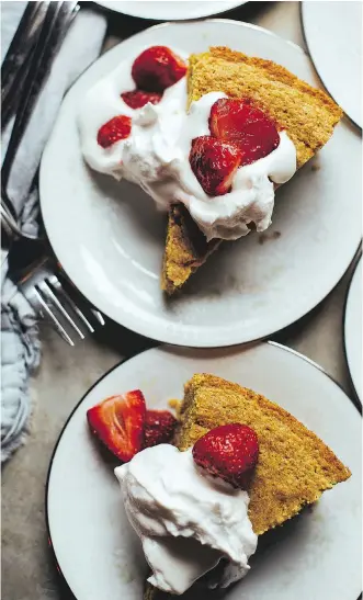  ?? LAURA WRIGHT ?? This vanilla corn cake is topped with roasted strawberri­es and whipped coconut cream.