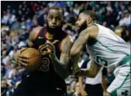  ?? THE ASSOCIATED PRESS FILE ?? LeBron James drives against the Celtics’ Marcus Morris earlier this season. James is looking to join an elite list of players to appear in eight consecutiv­e NBA finals.