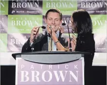  ?? CHRIS YOUNG THE CANADIAN PRESS ?? Patrick Brown celebrates on stage with his wife, Genevieve Gualtieri, after winning the Brampton mayoral election on Monday night.