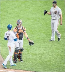  ?? DARREN HAUCK – THE ASSOCIATED PRESS ?? Milwaukee’s Ryan Braun, left, reacts to being hit by a pitch from the Giants’ Madison Bumgarner, right, in sixth inning of Sunday’s game.