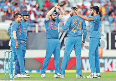  ?? AFP ?? ■ A big factor in India’s win in second T20 at Auckland was the impressive show by bowlers, especially Krunal Pandya (second from right) and Khaleel Ahmed (extreme right).