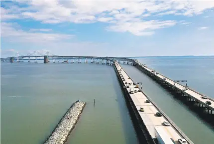  ?? JEFFREY F. BILL/CAPITAL GAZETTE ?? Traffic moves quickly on the Chesapeake Bay Bridge near Sandy Point Tuesday during rush hour. Public comment sessions are scheduled this week on a plan to build a third Maryland span over the Chesapeake Bay.