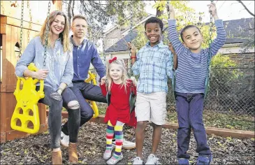  ?? SUE OGROCKI / ASSOCIATED PRESS ?? Oklahoma City couple Stephanie and Lance Schmidt, with their children Stella (from left), Solomon and Theo, have opted for a cost-sharing ministry this year after they realized their monthly insurance bill would have more than doubled to over $1,200...