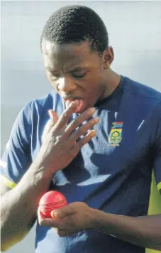  ?? /Reuters ?? No go: SA fast bowler Kagiso Rabada prepares to shine the ball with saliva, an act that will be prohibited when cricket resumes.