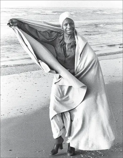  ?? Max Nash
Associated Press ?? JAZZ SINGER Nina Simone plays on a Tel Aviv beach on Jan. 2, 1978. She walked away from public life while in her prime.