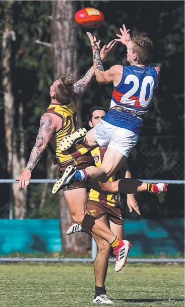  ?? Picture: STEWART McLEAN ?? SUPER SATURDAY: Centrals Trinity Beach Bulldogs’ Nicholas Thacker marks over Manunda Hawks’ Alexander Carter in their weekend clash at Watsons Oval.