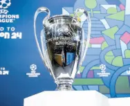  ?? AP ?? The Champions League trophy on display during the quarter-final draw of the UEFA Champions League 2023/24, at the UEFA headquarte­rs in Nyon, Switzerlan­d yesterday.