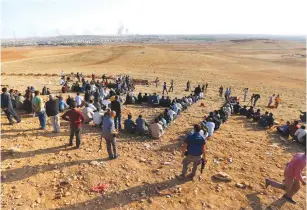  ?? (Reuters) ?? KURDS IN Syria flee the Turkish and Syrian rebel offensive against their formerly peaceful towns last month.