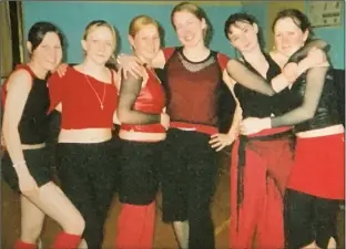  ??  ?? Leila Evans (third from right), whose maiden name is Owen, is trying to make contact with the other people in this photo which was taken in the hall of Enniscorth­y Vocational College in 2003.