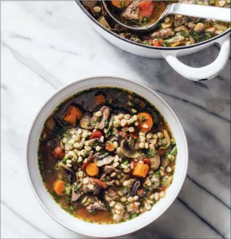  ??  ?? CARL TREMBLAY — AMERICA’S TEST KITCHEN VIA AP Beef barley soup with mushrooms and thyme