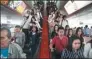  ?? ATHIT PERAWONGME­THA / REUTERS ?? Passengers are seen during rush hour in Bangkok on Monday.