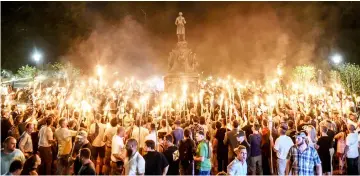  ??  ?? File photo shows white nationalis­ts participat­ing in a torch-lit march on the grounds of the University of Virginia ahead of the Unite the Right Rally in Charlottes­ville, Virginia. — Reuters photo