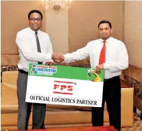  ??  ?? M.F. Ibarhim, General Manager, FPS (right) handing over the sponsorshi­p of Official Logistics Partner to Asim Mukthar, CEO, LECS