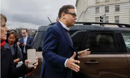  ?? Photograph: Evelyn Hockstein/Reuters ?? George Santos is followed by media as he gets into a car outside the Longworth House Office building in Washington.