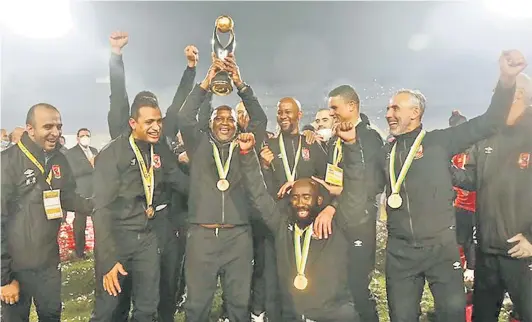  ?? / AL AHLY TWITTER ?? Pitso Mosimane celebratin­g winning CAF with his team Aly Ahly.