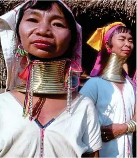  ??  ?? Height of fashion: Giraffe women of the Kayah state, Myanmar