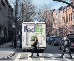  ?? DREW ANGERER GETTY IMAGES FILE PHOTO ?? FedEx’s shares have climbed 12 per cent this year, cutting its losses to 23 per cent.